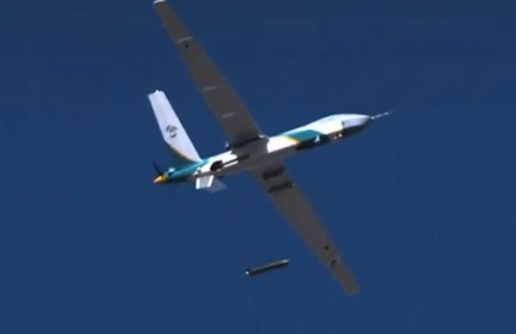 A Wing Loong-series UAV in flight dropping a munition-shaped canister carrying supplies. (CCTV)