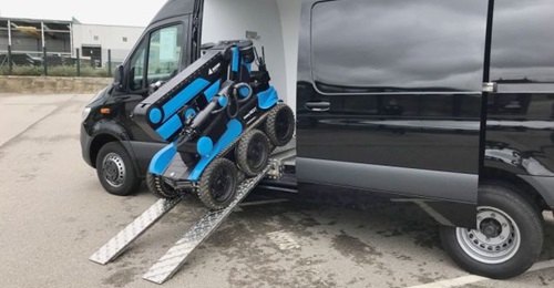 An aunav.NEXT EOD robot being deployed from a aunav.VAN command and control vehicle.