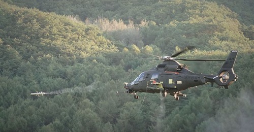 KAI announced on 11 December that DAPA provisionally declared the LAH helicopter (seen here test-firing the locally developed Chungum ATGM) fit for combat operations.
