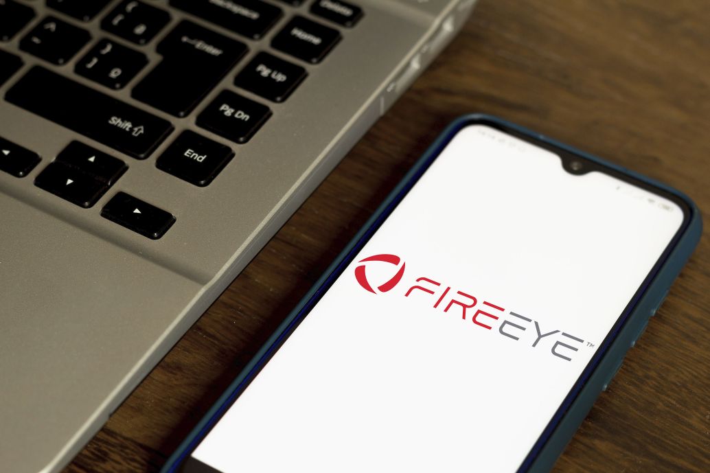 The FireEye corporate logo is shown on a smartphone on 7 July 2020. FireEye was the subject of a sophisticated cyber intrusion that subsequently revealed operations against US government entities, among others. (Rafael Henrique/SOPA Images/LightRocket via Getty Images)