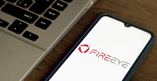 The FireEye corporate logo is shown on a smartphone on 7 July 2020. FireEye was the subject of a sophisticated cyber intrusion that subsequently revealed operations against US government entities, among others.