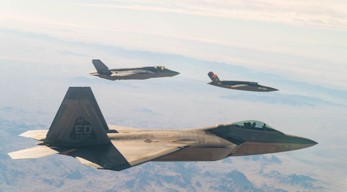 A US. Air Force F-22 Raptor and F-35A Lightning II fly in formation with the XQ-58A Valkyrie UAV over the U.S. Army Yuma Proving Ground testing range in Arizona, during a series of gatewayONE 'fifth generation' connectivity tests on 9 December.