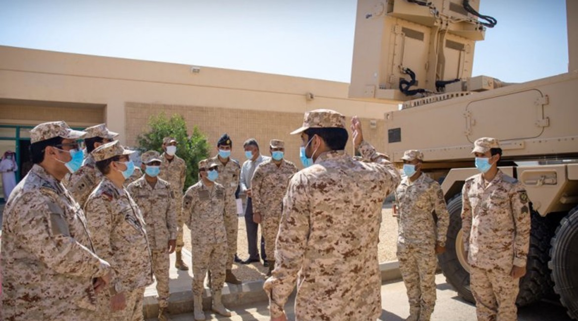 Saudi Arabia National Guard members inspect a Cobra counter-battery radar system