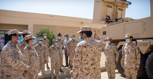 Saudi Arabia National Guard members inspect a Cobra counter-battery radar system