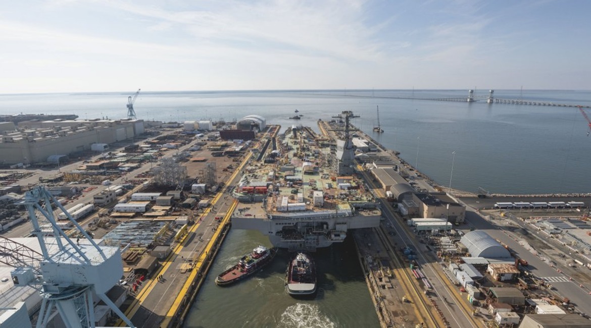 The aircraft carrier 
        
         (CVN 79) is among the ships that Huntington Ingalls Industries is building for the US Navy.