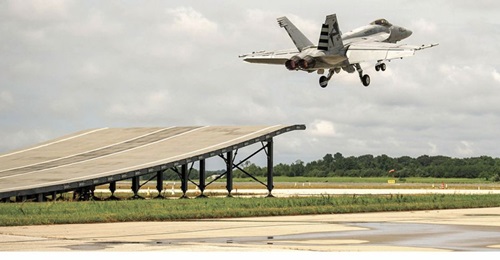 An F/A-18E Super Hornet successfully completes a first ski-jump launch demonstration on 13 August.