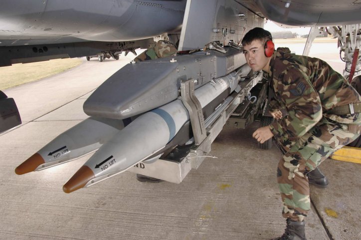 A US Air Force loader seen fitting SDB I bombs to an F-15E combat aircraft. Saudi Arabia is set to carry the munition on its F-15SA aircraft. (US Air Force)