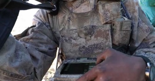 A still from CCTV footage released on 29 December showing a soldier under the PLAGF's Tibet Military District operating a tablet-like handheld computer during a recently held 'informationised comprehensive combat drill' at an undisclosed location in Ti...