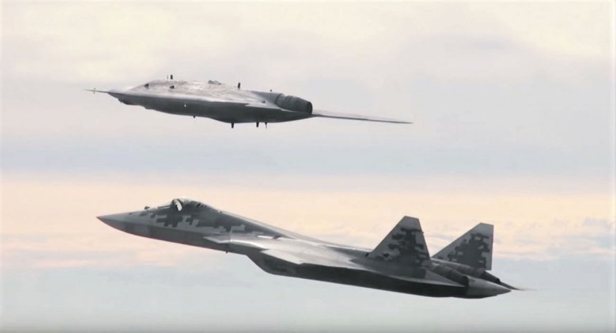 Russia’s stealthy Okhotnik heavy UAV conducting a manned/unmanned teaming test flight with an Su-57 fighter. In 2020 the Russian MoD gave priority to unmanned aviation and received its first serial production Su-57. (Russian MoD)