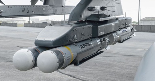 Four CSDB-1 munitions hang from the wing of an F-16 fighter from the US Air Force Test Center's 96th Test Wing at Eglin Air Force Base, Florida. Two of the bombs were dropped during the first flight demonstration of the Air Force Golden Horde Vanguard.