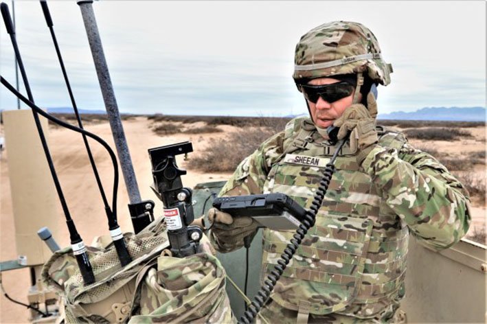 A US Army soldier conducts tests on prototype RF networked communication systems at Fort Bliss, Texas. (Credit: US Army )