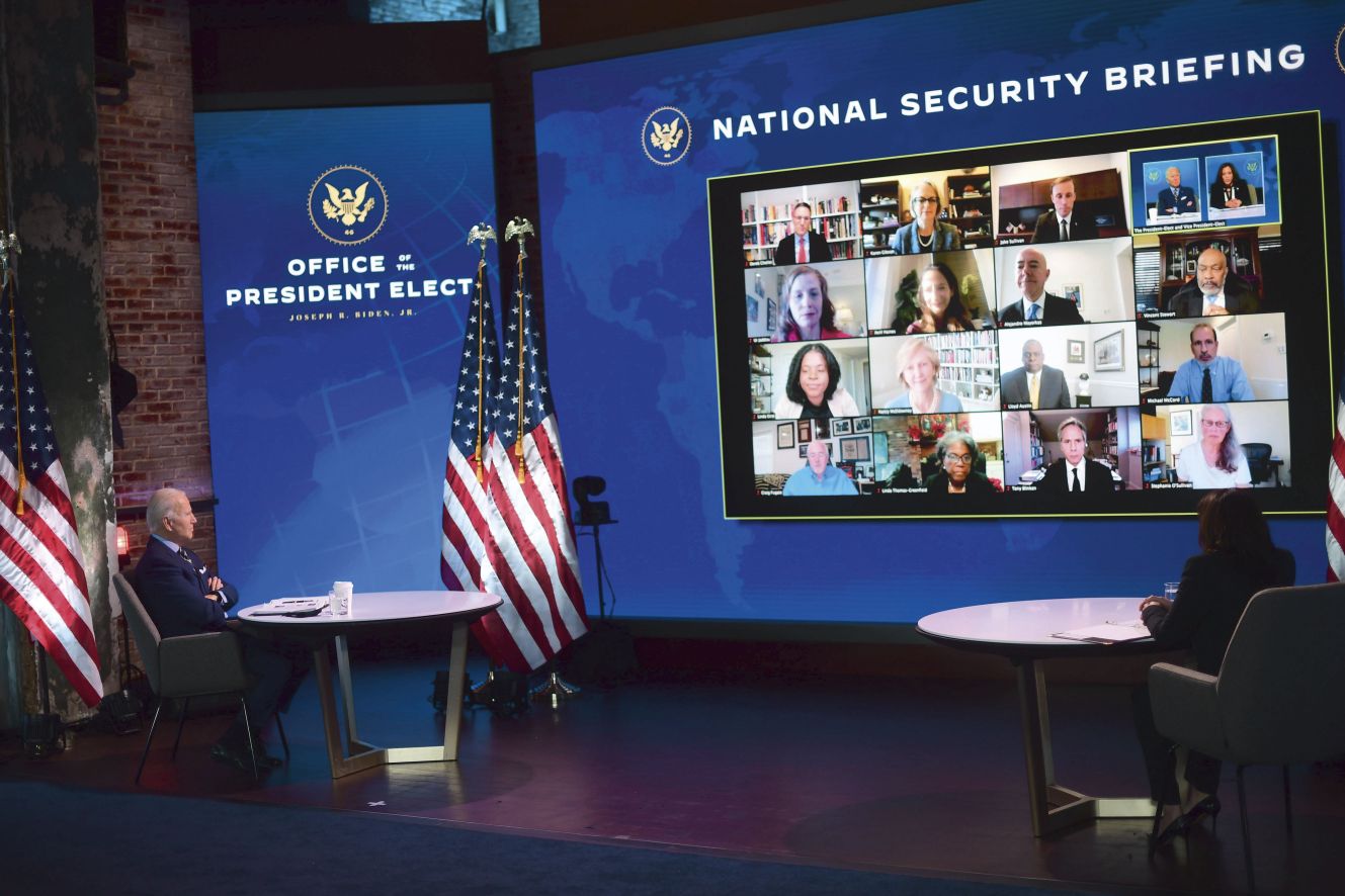 Then President-elect Joe Biden and Vice-President-elect Kamala Harris are briefed by expert members of Biden’s national security and foreign policy agency review teams at the Queen Theater on 28 December 2020 in Wilmington, Delaware. No major cyber attacks against the 2020 election took place, although cyber security will be a key national security challenge for the new administration following the revelation of the cyber attack exploiting the Solarwinds Orion application. (Mark Makela/Getty Images)
