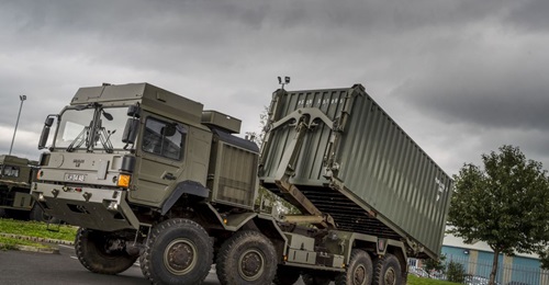 The RMMV HX 8×8 upgraded with an Enhanced Pallet Loading System and carrying a standard 20×8×8 ISO container.