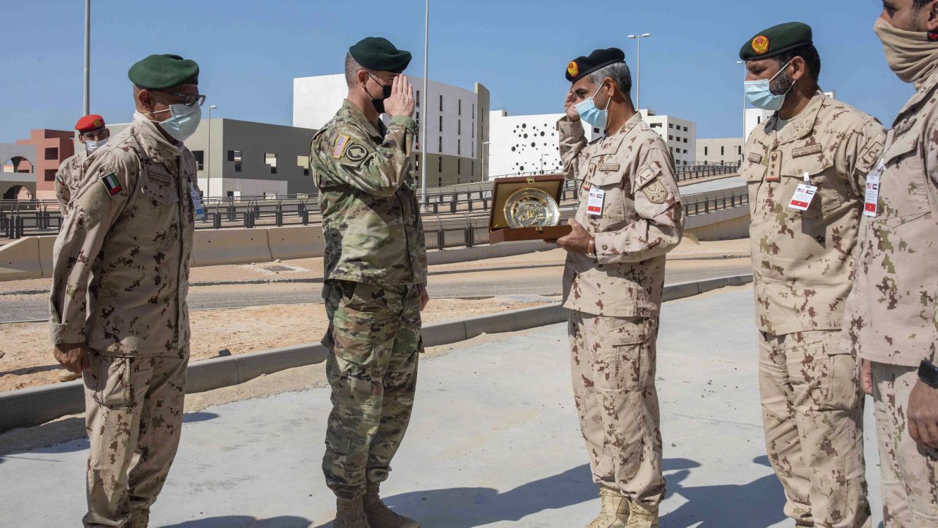 General Brigadier General Keith Phillips, US defense attaché in Abu Dhabi, exchanges gifts with Brigadier General Sultan al-Niyadi during a joint exercise with US marines and the UAE Presidential Guard at the Al-Hamra Combat Training Centre on 16 January (US Marine Corps)