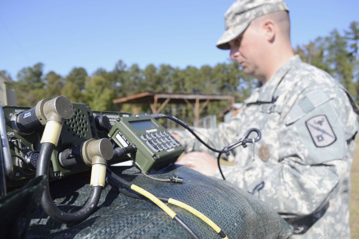 A US Army radio operator-maintainer works on an AN/PRC 1510 high-frequency radio at Fort Gordon, Georgia.   (Credit: US Army )