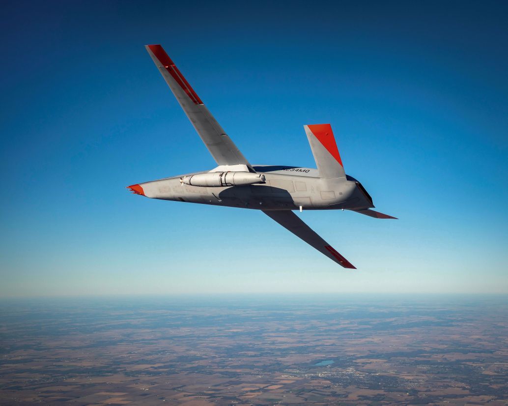 A Cobham Mission Systems refuelling pod flies under the left wing of a Boeing MQ-25 unmanned aircraft during a December 2020 test. (Credit: Boeing)