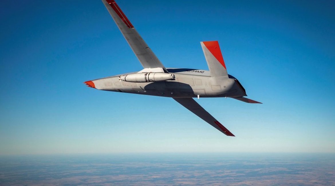 A Cobham Mission Systems refuelling pod flies under the left wing of a Boeing MQ-25 unmanned aircraft during a December 2020 test.
