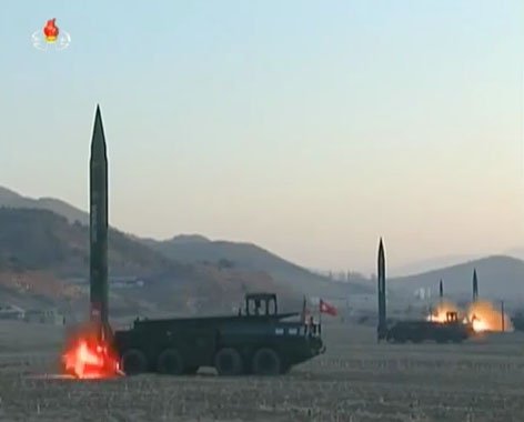A still from a video released by North Korean state media shows four R-17 (SS-1 ‘Scud’)-like missiles being test-fired in 2017. South Korea’s MND said in its 2020 Defense White Paper that North Korea had increased the number of its missile brigades from 9 to 13. (KCNA)
