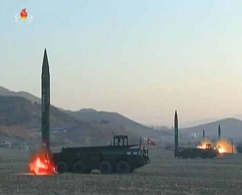 A still from a video released by North Korean state media shows four R-17 (SS-1 'Scud')-like missiles being test-fired in 2017. South Korea's MND said in its 2020 Defense White Paper that North Korea had increased the number of its missile brigades fro...