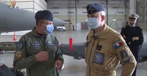An Egyptian and French officer stand in front of a SCALP cruise missile in a still from the exercise video.