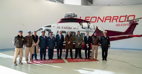 Qatari Minister of State for Defence Affairs Dr Khalid bin Mohammed al-Attiyah (fifth from right) stands in front of a AW169 painted in the colours of Qatar's Al-Zaeem Air College.