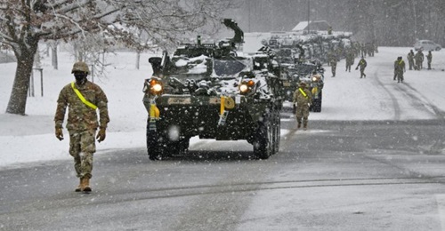 US soldiers assigned to 1st Squadron, 2nd Cavalry Regiment guide Stryker vehicles during railhead operations at Rose Barracks, Vilseck, Germany, in January. The army is working with Lockheed Martin on a MAPS base kit for multiple vehicle fleets.