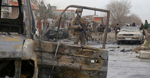 An Afghan soldier stands guard at the site of an attack in Kabul in December 2020. The number of civilian casualties in the fourth quarter of last year increased by 45% compared to the same period in 2019, according to a 23 FebruaryUN report.