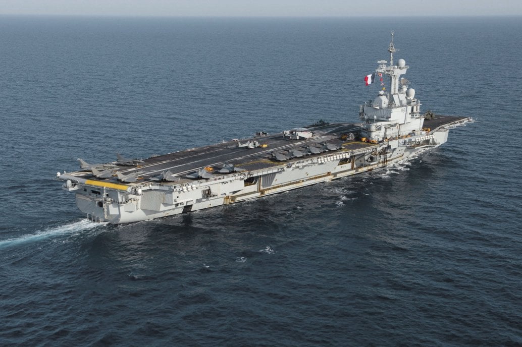 The French Navy’s carrier strike group led by the aircraft carrier FS Charles de Gaulle (pictured) will join ‘Dynamic Manta’ as it transits the exercise area during a pre-deployment work up. (USN)