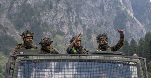 An Indian army convoy carries reinforcements and supplies towards Leh, on a highway bordering China, on 2 September 2020 in Gagangir, India, following renewed clashes between China and India over their shared border. Although China is committed not to ...
