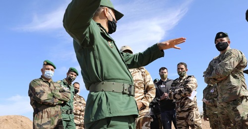 An officer with the Royal Moroccan Armed Forces explains the capabilities of firing at range during a site survey in preparation for African Lion 2021.