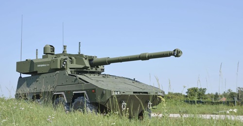 A Boxer MRAV with its rear mission module mounting the John Cockerill Defense C3105, and showing the roof-mounted commander's panoramic sighting system.