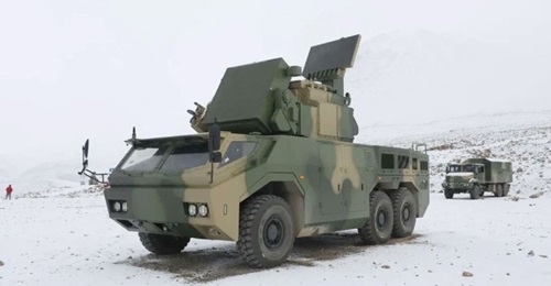 China has cleared the HQ-17AE self-propelled SHORAD system (foreground) for export, according to a 7 March report by the state-owned 
        
         newspaper.