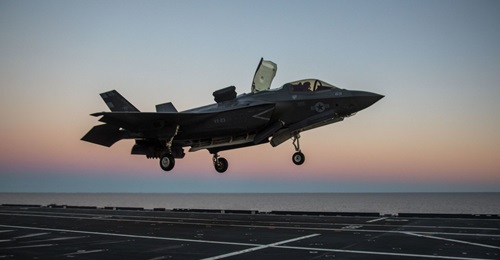 F-35 test pilot Major Brad Leeman performs a vertical landing with an F-35B aboard Italian aircraft carrier ITS 
        
         (CVH 550) on 3 March 2021. The Pentagon and Lockheed Martin reached a settlement over costs incurred by the Depa...