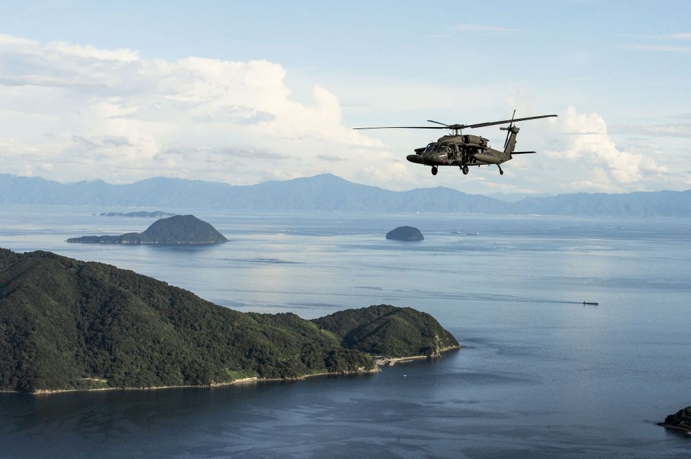 A US Army UH-60 Blackhawk flies in formation over Yamaguchi Bay, Japan during Orient Shield 2019. The service is standing up a multi-domain task force in the Indo-Pacific region but hasn’t announced where soldiers will be located. (US Army )
