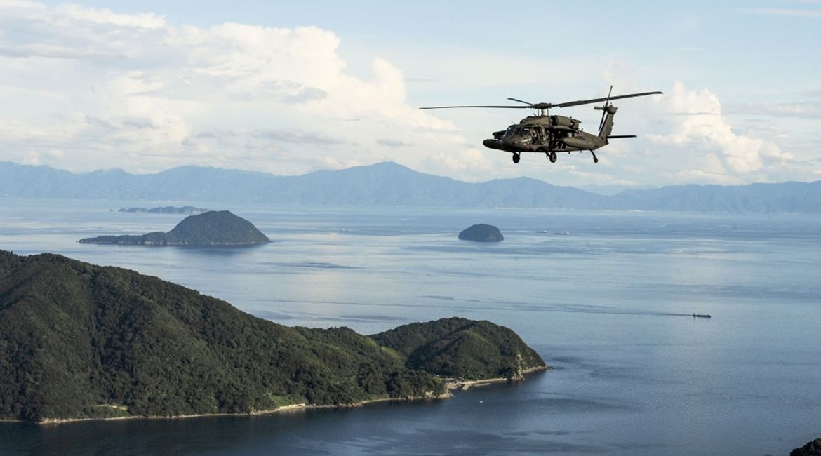 A US Army UH-60 Blackhawk flies in formation over Yamaguchi Bay, Japan during Orient Shield 2019. The service is standing up a multi-domain task force in the Indo-Pacific region but hasn't announced where soldiers will be located.