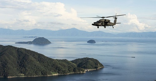 A US Army UH-60 Blackhawk flies in formation over Yamaguchi Bay, Japan during Orient Shield 2019. The service is standing up a multi-domain task force in the Indo-Pacific region but hasn't announced where soldiers will be located.