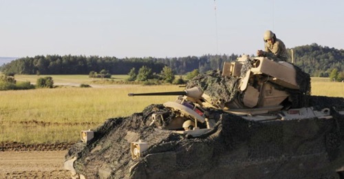 A US soldier awaits orders for movement during a combined arms live-fire exercise at Grafenwoehr Training Area, Germany in September 2020.