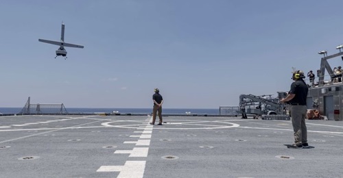 A Martin UAV V-Bat VTOL unmanned aircraft prepares to land on the flight deck of the Military Sealift Command's Spearhead-class catamaran expeditionary fast transport vessel USNS 
        
         (T-EPF 1) on 24 July 2019. The V-Bat's abilit...
