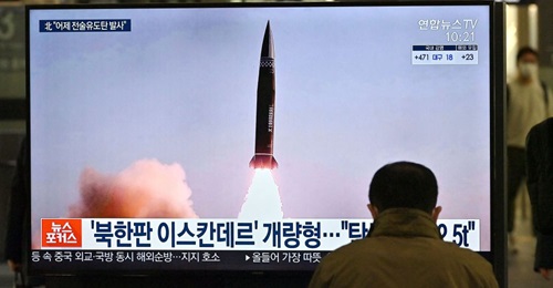 News footage of North Korea's latest SRBM test launch shown on a TV screen at Suseo railway station in Seoul on 26 March. Pyongyang appears to have test-fired the previous day an SRBM type that it first showcased on 14 January.
