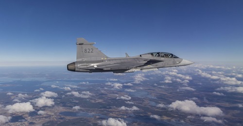 The bright silver panel that was 3D printed can be seen attached to the aft section of the Gripen D testbed during its first flight earlier in March.
