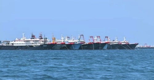 An image captured on 7 March showing some of the Chinese fishing vessels moored near the disputed Whitsun Reef in the Spratly island chain.