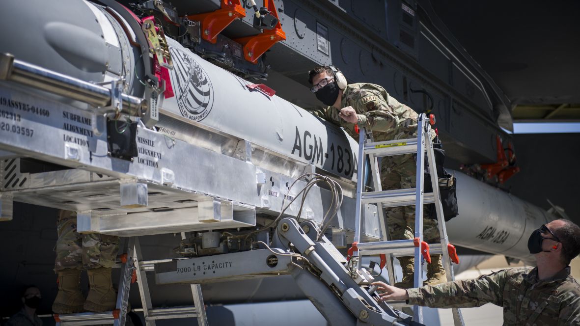 A US Air Force airman helps line up the AGM-183A Air-launched Rapid Response Weapon (ARRW) as it is loaded under the wing of a B-52H on 6 August 2020. The ARRW failed its first booster vehicle flight test on 5 April as it could not complete its launch sequence and did not deploy from the B-52H carriage aircraft. (US Air Force)