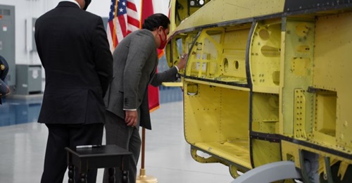 Bahrain Ambassador to United States, Shaikh Abdulla Al Khalifa, signs the first of 12 AH-1Z attack helicopters for the Royal Bahraini Air Force during a visit to Bell's Amarillo production plant in Texas.
