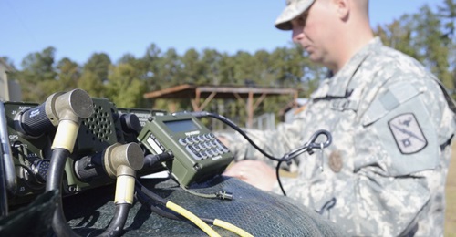 A US Army radio operator-maintainer works on a AN/PRC 1510, high-frequency radio at Fort Gordon, Georgia.