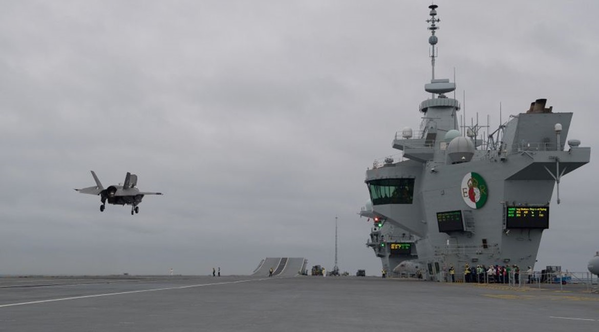 An F-35B prepares to land aboard the RN carrier HMS 
        
        . In March, the Naval Air Traffic Management Systems Program Office completed a critical step in readying the ship for its first operational deployment with PALS certificati...