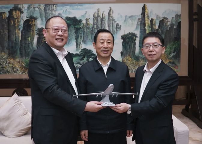 A model of the in-development CH-6 armed reconnaissance UAV being presented to Hunan Provincial Committee secretary and Hunan Provincial People’s Congress Standing Committee director Xu Dazhe by CAAA president Hu Meixiao and secretary Wang Xianyu on 16 March.  (China Academy of Aerospace Aerodynamics)