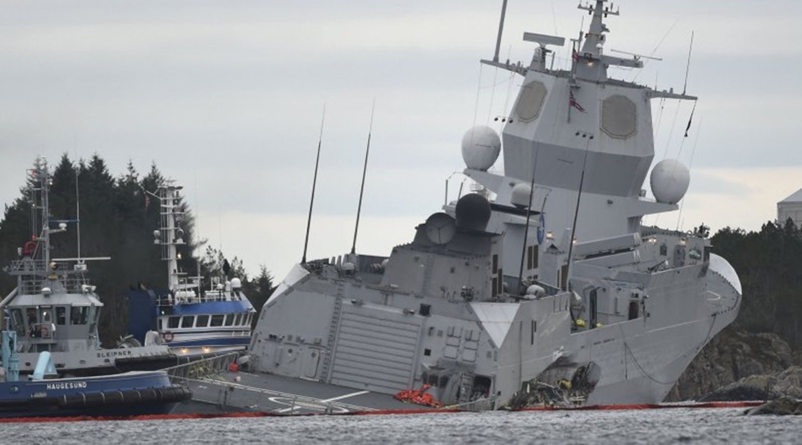 The Norwegian frigate HNoMS 
        
         takes on water after colliding with the tanker 
        
         on 8 November 2018 in the Hjeltefjord near Bergen.