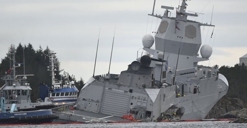 The Norwegian frigate HNoMS 
        
         takes on water after colliding with the tanker 
        
         on 8 November 2018 in the Hjeltefjord near Bergen.