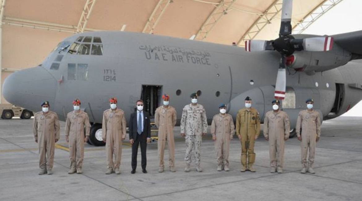 French ambassador Xavier Chatel and Emirati personnel stand next to the C-130 before it departs for its mission in the Sahel.