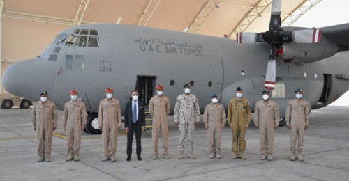 French ambassador Xavier Chatel and Emirati personnel stand next to the C-130 before it departs for its mission in the Sahel.